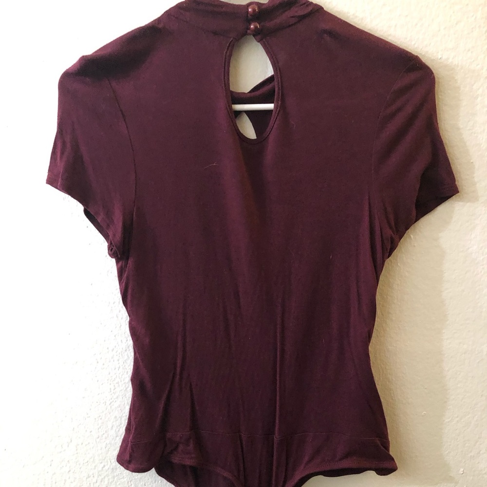 Cute burgundy body suit.